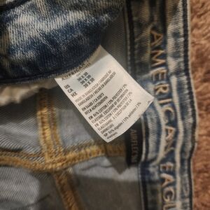 American Eagle faded blue skinny ripped jeans